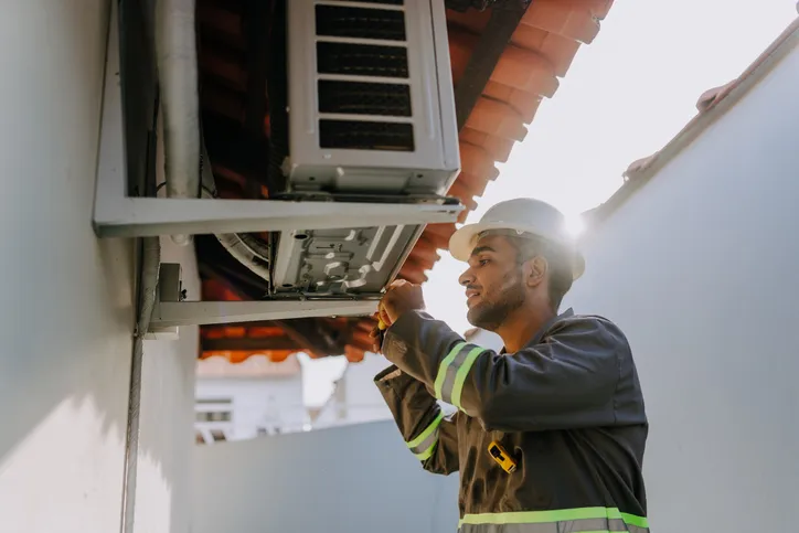 A technician working on HVAC System